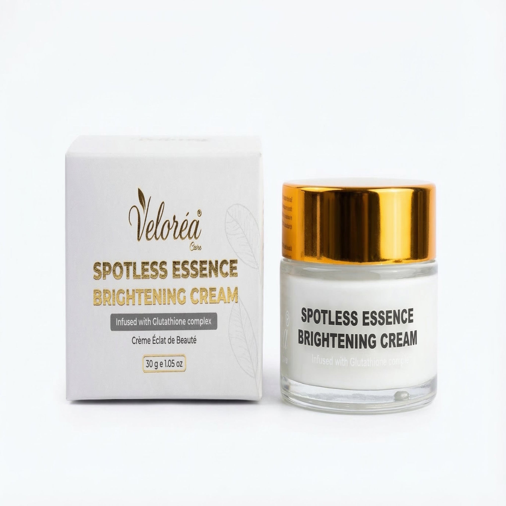 Veloreá Spotless Essence Brightening Cream with packaging on a white background